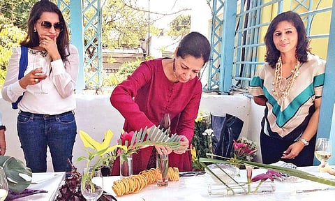 Chatterbox Club Members learning Ikebana