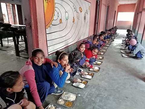 Children of Sahori Government school in Vaishali district of Bihar having mid-day meal under the supervision of principal Alok Ranjan. (File Photo | Express)