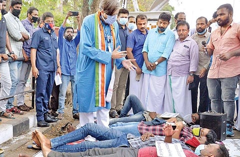 Shashi Tharoor, MP, interacting with protesting job aspirants in front of the Secretariat in Thiruvananthapuramon Saturday | Vincent Pulickal
