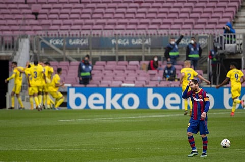 Barcelona's Lionel Messi, right, reacts during the Spanish La Liga match between FC Barcelona and Cadiz at the Camp Nou stadium in Barcelona, Spain, Sunday, Feb. 21, 2021. (Photo | AP)
