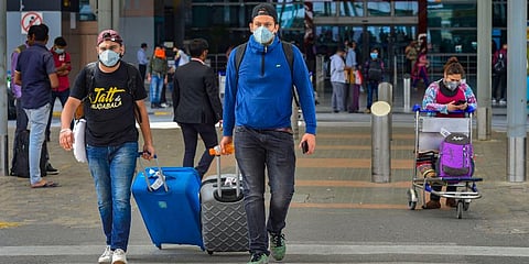 Passengers wear masks in the wake of Coronavirus pandemic at Indira Gandhi International Airport in New Delhi. (Photo | PTI)