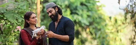 Still of Aditi Rao Hydari and Dev Mohan from 'Sufiyum Sujatayum'