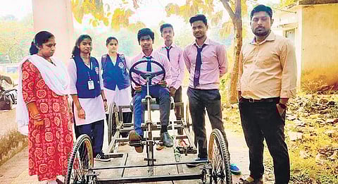 Students posing alongside their newly-devised manual grass-cutter | express