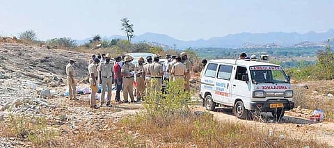 Police personnel inspect the quarry site where gelatin sticks exploded, killing six people, at at Hirenagavalli village, in Chikkaballapur district in the wee hours of Tuesday