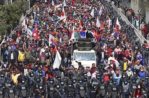 Nepalese supporters of a splinter group in the governing Nepal Communist Party participate in a rally to celebrate the Supreme Court order in Kathmandu. (Photo| AP)