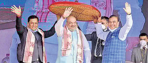 Union Home Minister Amit Shah, Assam CM Sarbananda Sonowal (left) and Finance Minister Himanta Biswa Sarma (Photo | PTI)