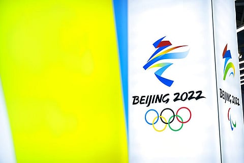 The logos for the 2022 Beijing Winter Olympics and Paralympics are seen at an exhibit at a visitors center at the Winter Olympic venues in Yanqing, Beijing. (Photo | AP)