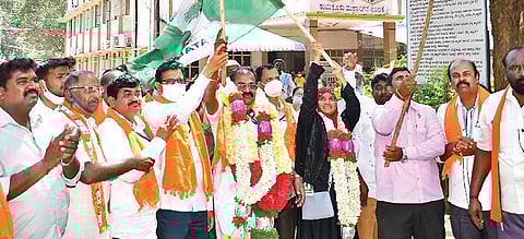 Newly-elected Mayor B G Krishnappa (BJP) and his deputy Nazeema Bi (JDS) celebrate their victory in Tumakuru on Friday | Express Photo
