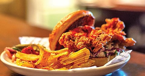 Chefs Priyam Kumar and Parth Saxena, flipping mean burgers at Gobsmackers in Delhi, nail it.