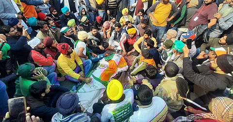 Farmers surround the body of a fellow protestor who died at ITO during the tractor parade on. (File Photo | Shekhar Yadav, EPS)