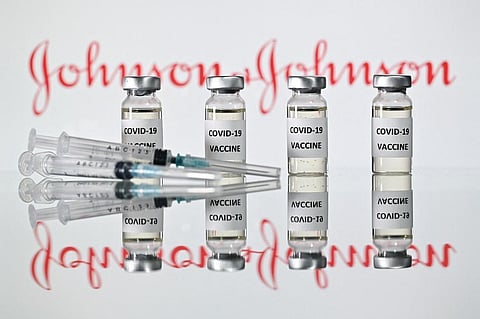 A file photo taken on November 17, 2020 shows vials with Covid-19 Vaccine stickers attached and syringes with the logo of US pharmaceutical company Johnson & Johnson. (Photo | AFP)