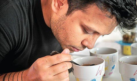 Suhas Dwarkanath slurps coffee