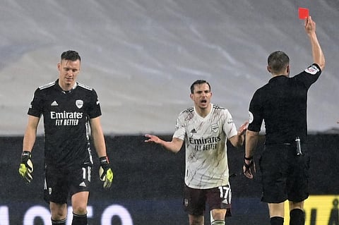 Arsenal's German goalkeeper Bernd Leno (L) leaves the field on being red carded during match against Arsenal at the Molineux stadium in Wolverhampton. (Photo | AFP)