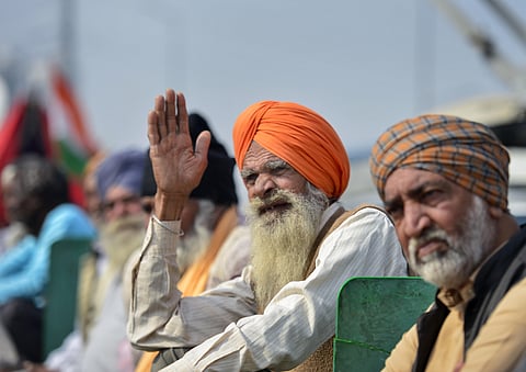 Farmers at Ghazipur border during the ongoing agitation over farm reform laws in New Delhi Wednesday. (Photo | PTI)