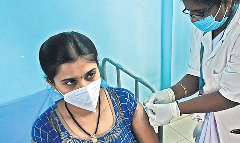 A frontline worker gets vaccinated for Covid-19 in Vijayawada. (Photo | EPS)