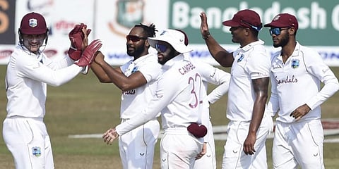 West Indies' players celebrate the dismissal of Bangladesh's Shadman Islam during the first day of the first cricket Test match at the Zohur Ahmed Chowdhury Stadium in Chittagong. (Photo | AFP)