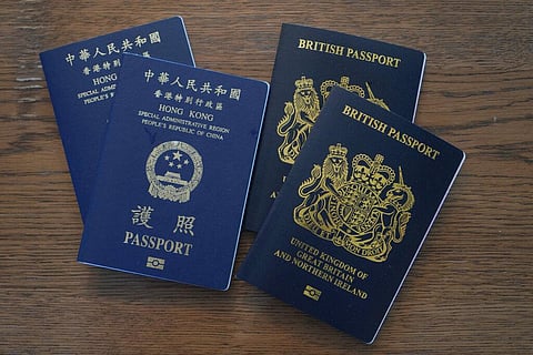 , British National Overseas passports (BNO) and Hong Kong Special Administrative Region of the People's Republic of China passports are displayed here. (Photo | AP)