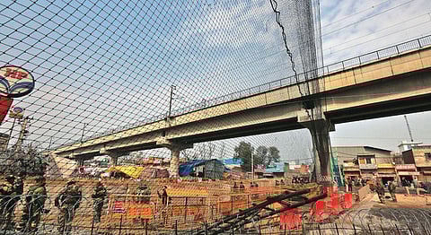 Large nets are installed at Tikri border to protect police from stone throwers near a protest site. (Photo | EPS)
