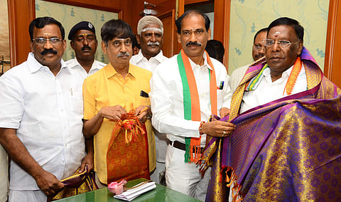 Three nominated BJP MLAs V Saminathan, K.G. Shankar and Selvaganapathy of Puducherry greeting Chief Minister V Narayanasamy at Puducherry legislative assembly. (Photo | Pattabi Raman/ EPS)