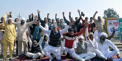 Protesting farmers during the Chakka jam called by them against farm laws, at Delhi Rohtak corridor near Tikri Border in Haryana. (Photo| ANI)
