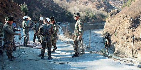 Rescue operations underway after a glacier broke off in Joshimath causing a massive flood in the Dhauli Ganga river in Chamoli district of Uttarakhand. (Photo | PTI)