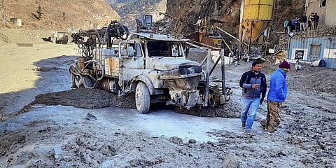 Locals inspect the site near damaged Dhauliganga hydropower project at Reni village after a glacier broke off in Joshimath causing a massive flood in the Dhauli Ganga river in Chamoli. (Photo | PTI)