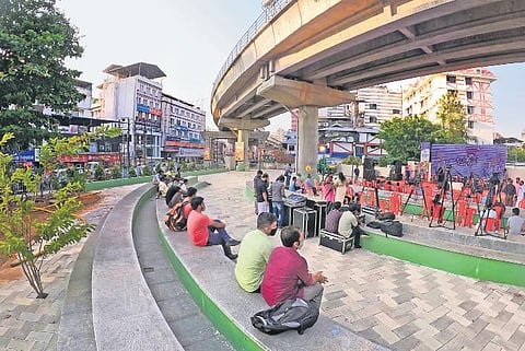Artist Charles Antony performing (top) at the inauguration of Arts Spaces Kochi at Jose Junction on Monday