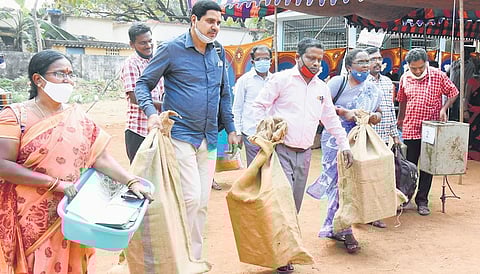 Government employees leaving for their allotted polling stations with poll material in Chittoor district on Monday I Madhav K