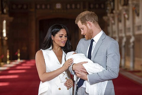 FILE | Britain's Prince Harry and Meghan, Duchess of Sussex, pose during a photocall with their newborn son Archie, in St George's Hall at Windsor Castle, Windsor, south England. (File Photo | AP)