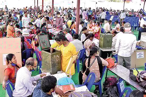 Verification of polling material underway at SV Arts College in Tirupati on Tuesday, a day ahead of the urban local body elections | Madhav K