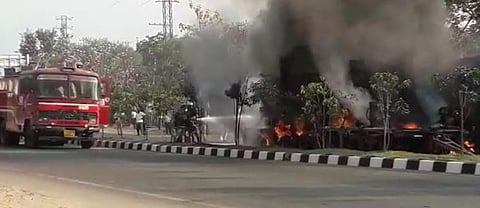 Fire personnel douse the blaze at Shameerpet where a lorry rammed into a container truck. (Screengrab)