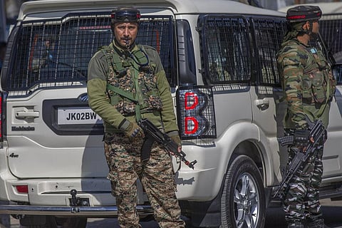 Indian paramilitary soldiers stand guard during a protest after Friday prayers in Srinagar. (Photo | AP)