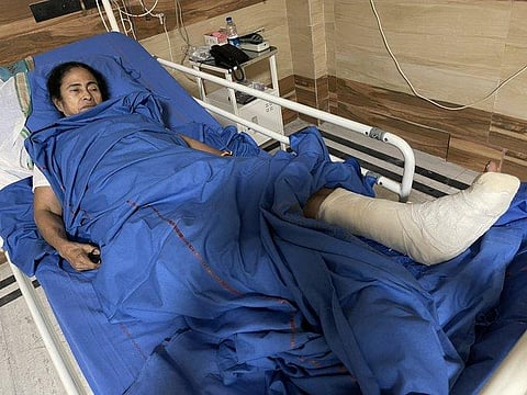 Mamata Banerjee with a cast on her left foot in the SSKM hospital in Kolkata after an injury during campaigning. (Photo | Twitter)