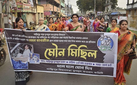 TMC supporters participate in a silent march condemining the alleged attack on West Bengal CM Mamata Banerjee in Nandigram, in Nadia district. (Photo | PTI)