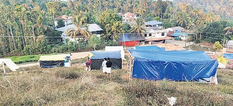 Temporary sheds set up by the protestors where new houses are being constructed for 52 families in Vithukadu