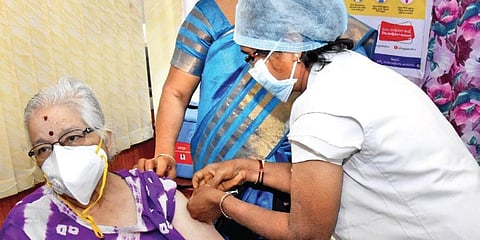An elderly woman gets Covid-19 vaccine jab in Tirupati on Friday (Photo | Madhav K, EPS)