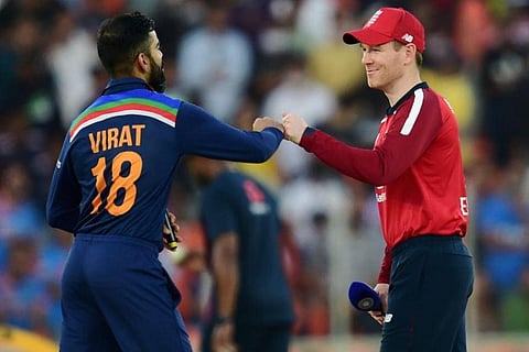 England skipper Eoin Morgan (R) and Indian skipper Virat Kohli during toss for the second T20 cricket series between India and England (Photo | PTI) England skipper Eoin Morgan (R) and Indian skipper