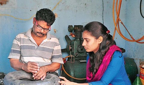 K Revathi (25) has been repairing deflated tyres of motorcycles and cars since she was in Class 8. She is now working in BEV Electronics in Vizag  | G Satyanarayana