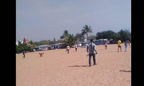 A group of fifty vendors gathered on the beach to pick up waste. (Photo | Express)