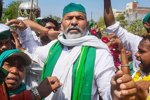 Bharatiya Kisan Union spokesperson Rakesh Tikait greeted by party workers on his arrival in Prayagraj Sunday March 14 2021. (Photo | PTI)