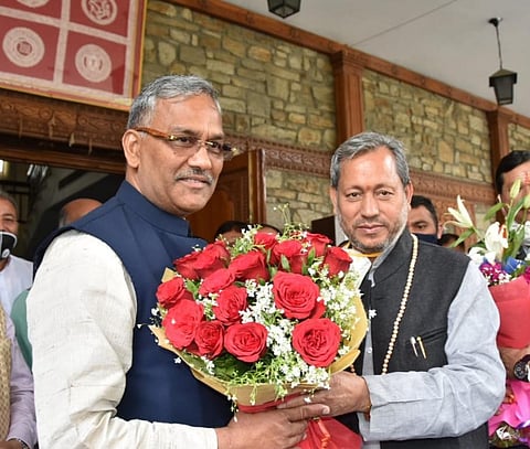  Trivendra Singh Rawat meets Tirath Singh Rawat at Chief Minister's official residence. (Photo | Express)