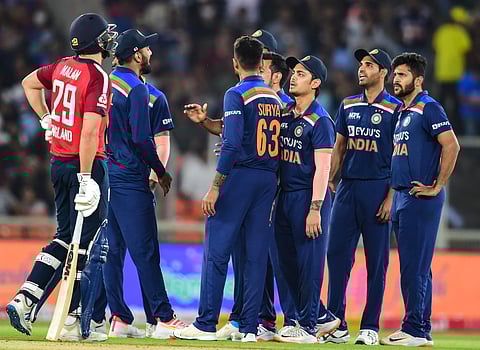 Indian cricketers celebrate the wicket of England batsman D Malan L during second T20 cricket match. (Photo | PTI)