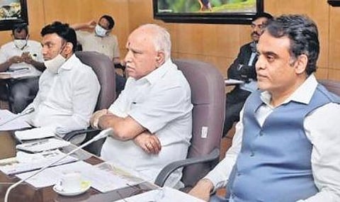 Chief Minister B S Yediyurappa, DyCM C N Ashwath Narayan and Health Minister Dr K Sudhakar at the Covid review meeting, in Bengaluru on Monday | EXPRESS