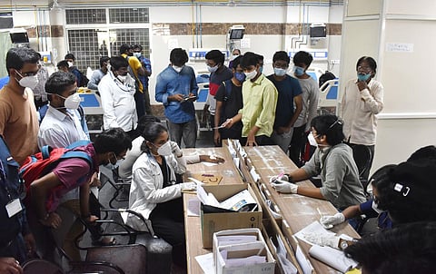 Osmania Medical College students wait at Gandhi Hospital after they were diagnosed with food poisoning. (Photo | S Senbagapandiyan, EPS)