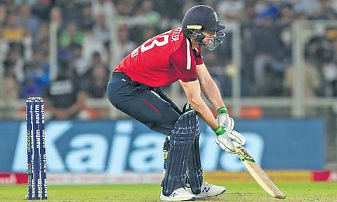 England’s Jos Buttler plays a scoop shot off Bhuvneshwar Kumar on Tuesday | AFP