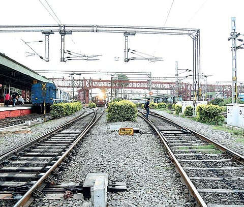 They were crossing the railway tracks as they were unable to climb the foot over bridge at Maraimalai Nagar Railway Station. 