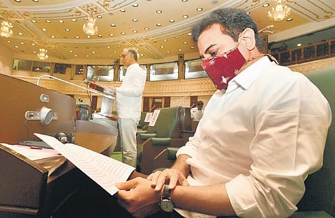 IT Minister KT Rama Rao studies the 2021 - 2022 Budget as Finance Minister  T Harish Rao presents it in the Telangana Assembly on Thursdays