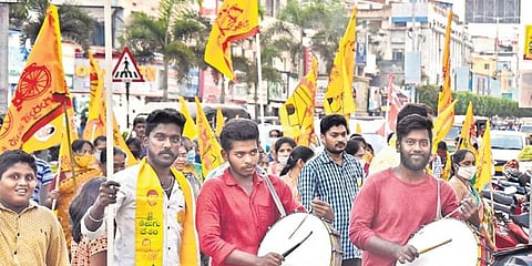 TDP workers during a poll campaign in Vijayawada on Monday (Photo | P Ravindra Babu, EPS)