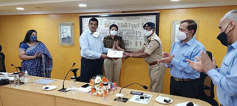 Assistant Sub-Inspector C Devaraj being honoured by Bengaluru Divisional Manager AK Verma on Monday. (Photo | Express)