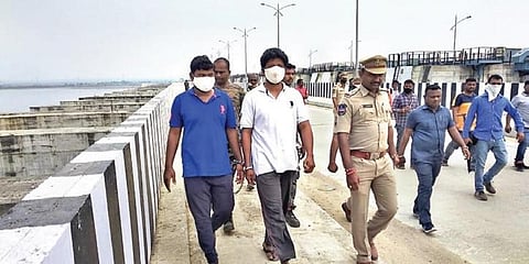 Police bring Kunta Srinivas and Sivanandula Chiranjeevi, who are currently in their custody, to the barrage to pinpoint where they had dropped the knives, on Monday.